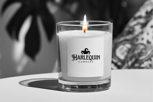 A lit soy candle with a trimmed wick, showing safe burning tips to extend candle life and enhance fragrance.