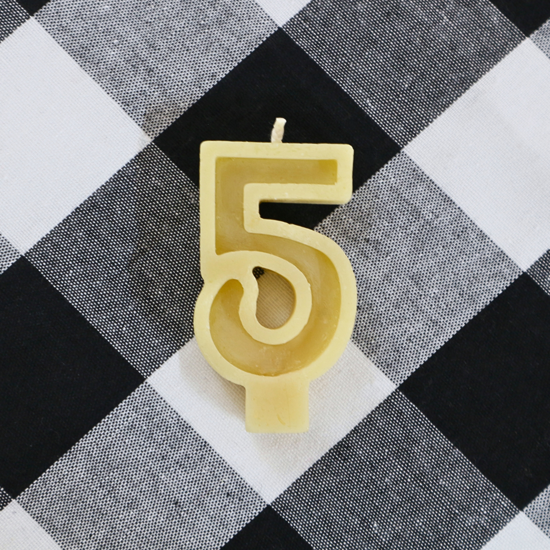 Handmade Australian beeswax number 5 birthday candle with a cotton wick for celebration cakes.