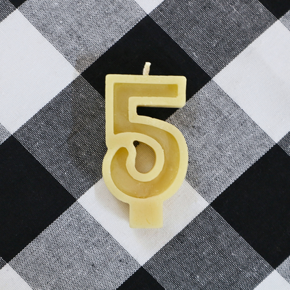 Handmade Australian beeswax number 5 birthday candle with a cotton wick for celebration cakes.