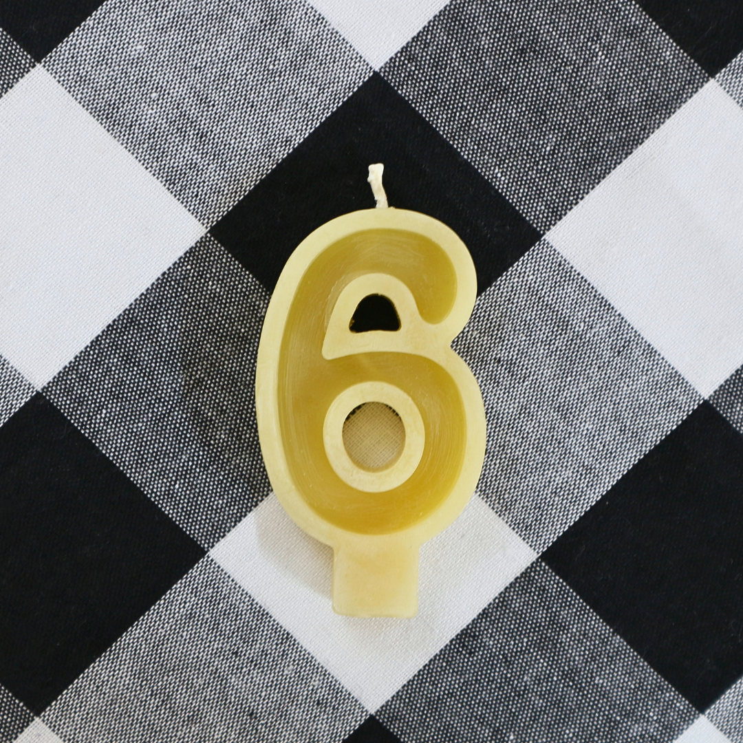Handmade Australian beeswax number 6 birthday candle with a cotton wick for birthday cakes.
