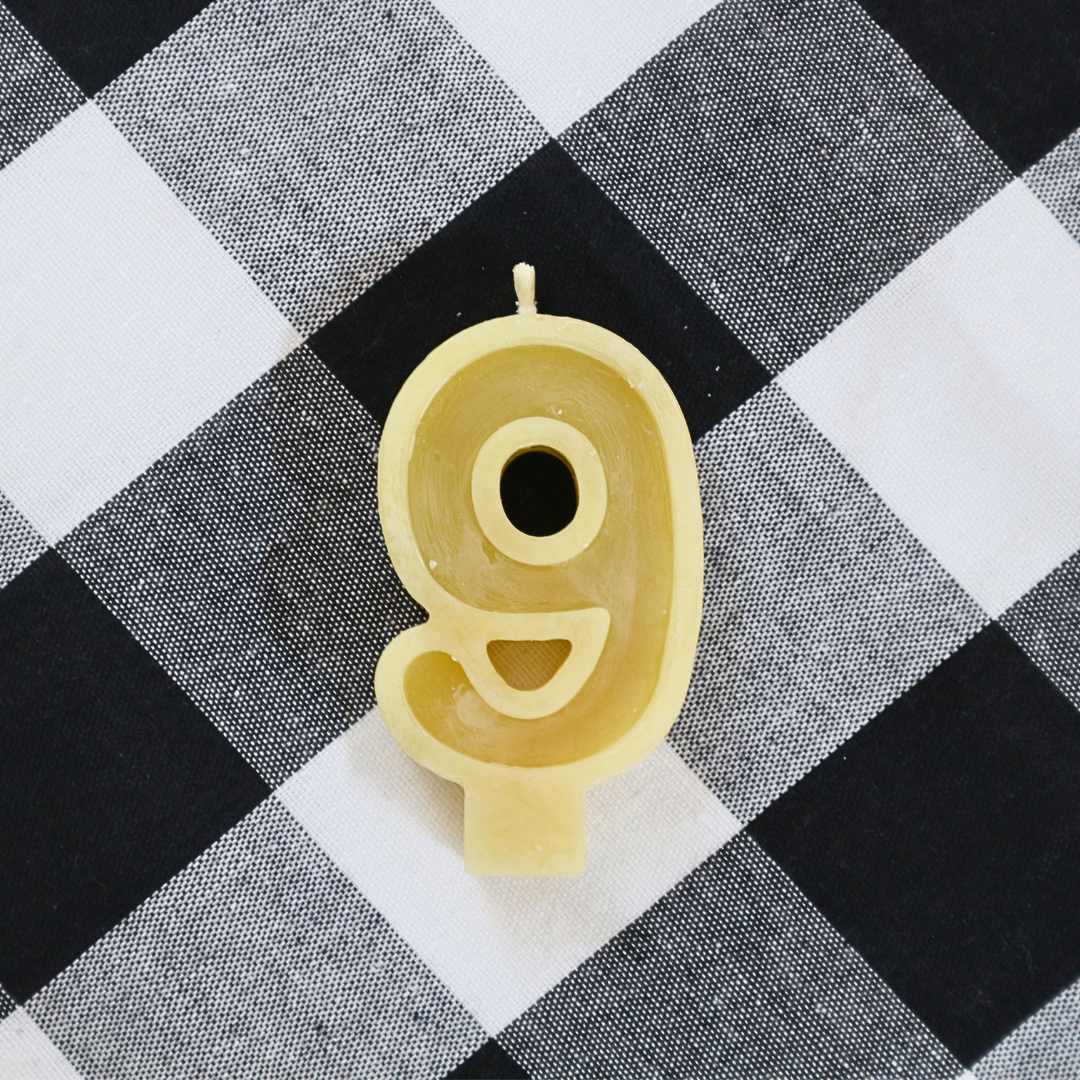 Handmade Australian beeswax number 9 birthday candle with a natural cotton wick.