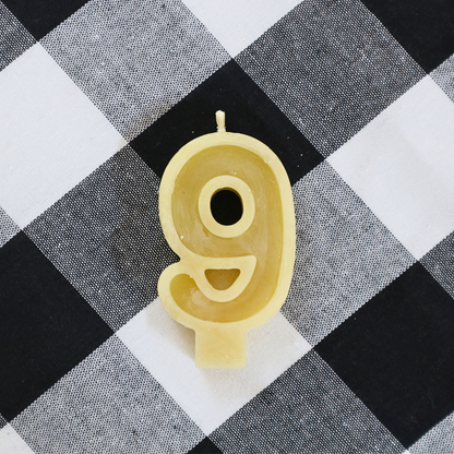 Handmade Australian beeswax number 9 birthday candle with a natural cotton wick.