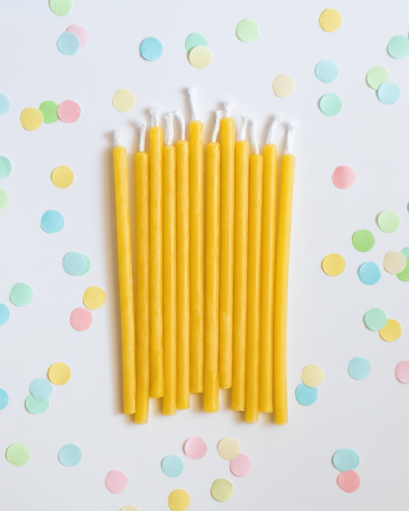 Yellow handmade Australian natural organic beeswax birthday candles. Non toxic cleaner burn for children's birthday cakes.