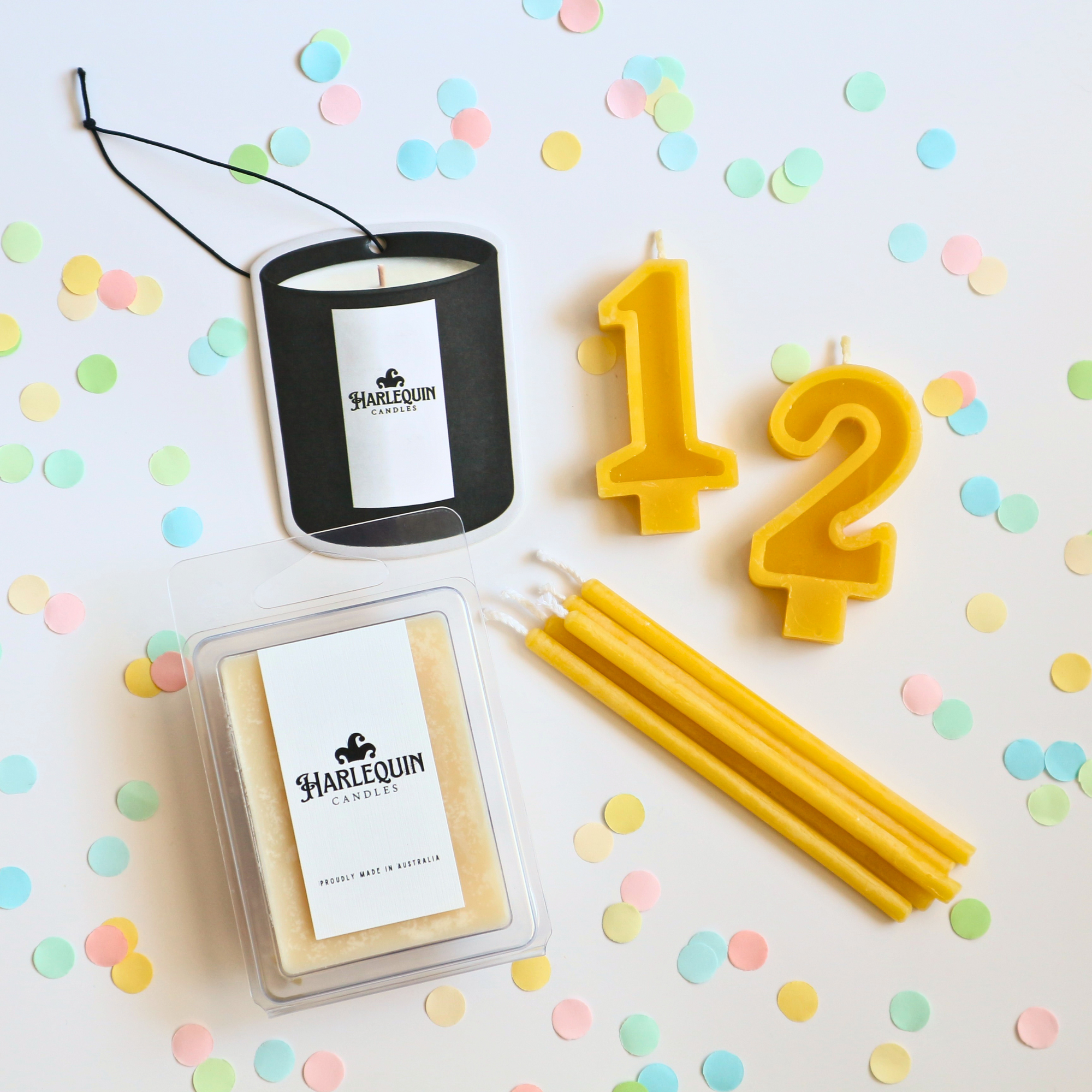 Harlequin candles under $10 products including car freshener, beeswax cake candles and number candles and handmade soy melts.