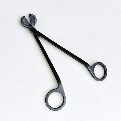 A sleek black candle wick trimmer with ergonomic handles, essential for maintaining your Harlequin Candles for a clean, even burn and extended candle life.
