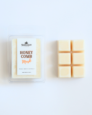 Harlequin Candles Honeycomb Musk soy wax melts clamshell package next to unwrapped 6-cube bar hand poured in Australia