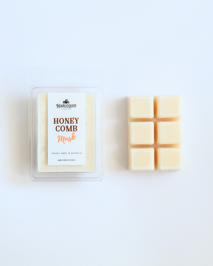 Harlequin Candles Honeycomb Musk soy wax melts clamshell package next to unwrapped 6-cube bar hand poured in Australia