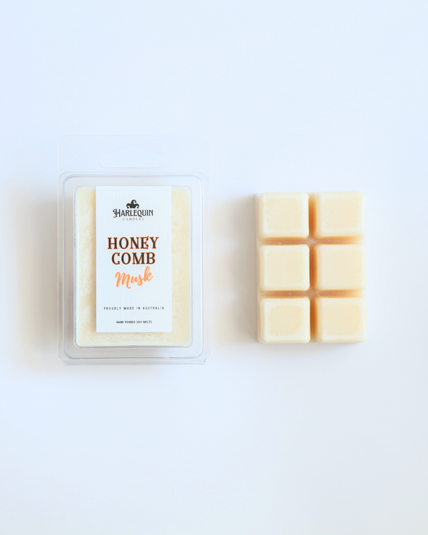 Harlequin Candles Honeycomb Musk soy wax melts clamshell package next to unwrapped 6-cube bar hand poured in Australia