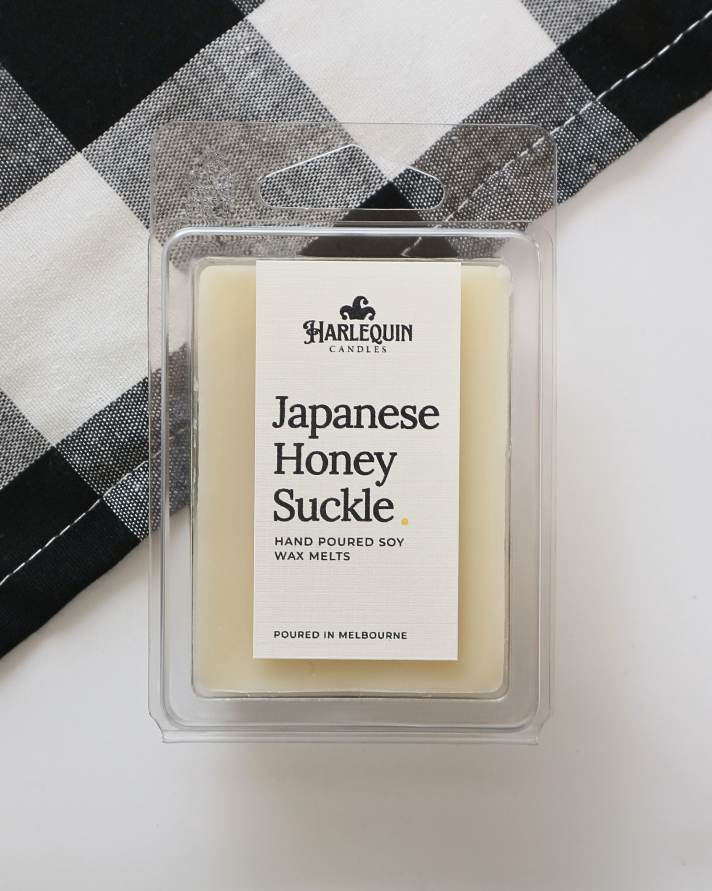 Harlequin Candles Japanese Honeysuckle soy wax melts in a clear clamshell, hand-poured in Melbourne with a fresh floral fragrance.