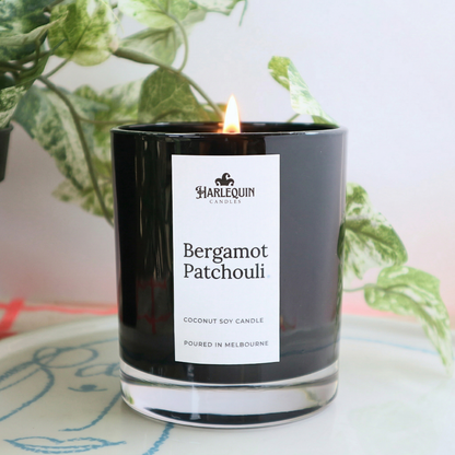 Bergamot Patchouli fragrant candle by Harlequin Candles in a sleek black gloss jar, handcrafted in Melbourne and featuring coconut soy wax.