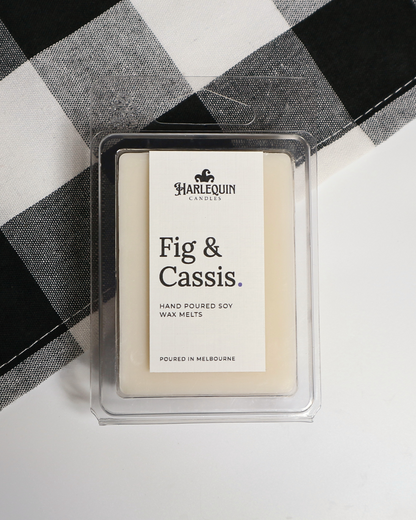 Fig & Cassis soy wax melts by Harlequin Candles, hand-poured in Melbourne with cassis, cedarwood and botanical notes in a clear clamshell.