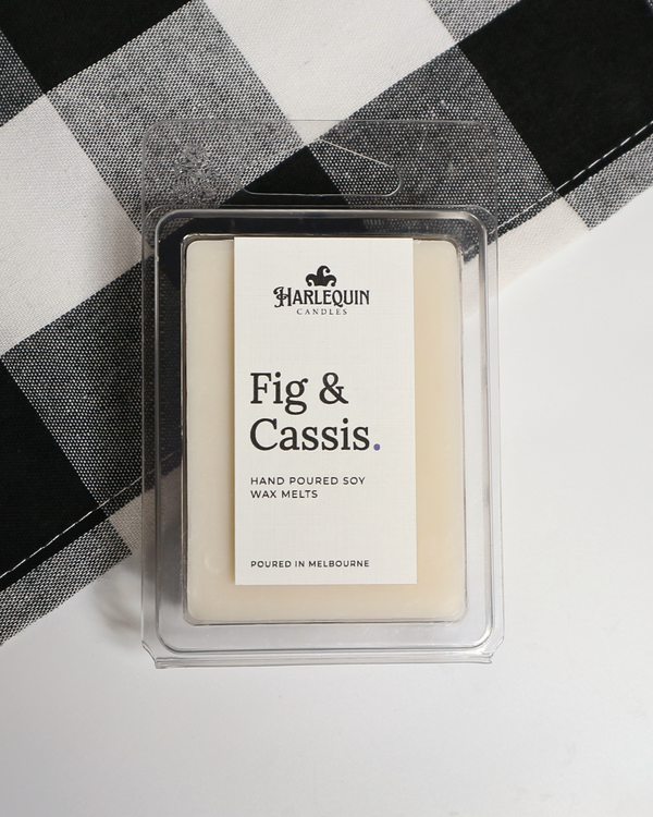 Fig & Cassis soy wax melts by Harlequin Candles, hand-poured in Melbourne with cassis, cedarwood and botanical notes in a clear clamshell.