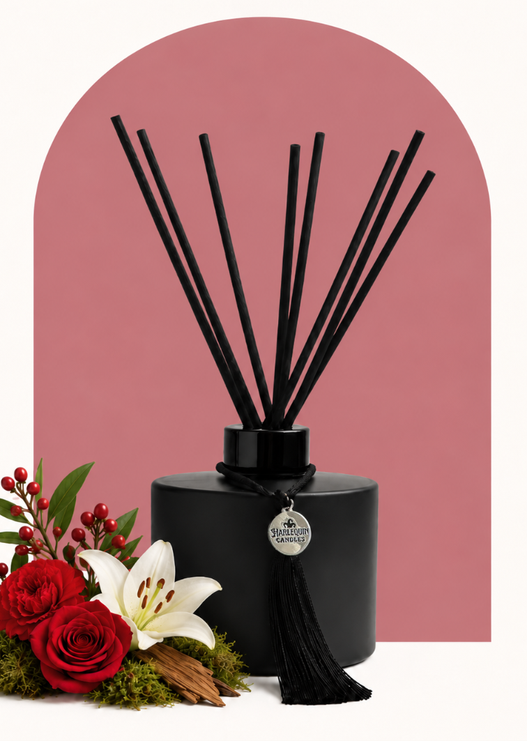 Flower Shop reed diffuser by Harlequin Candles, hand-poured in Melbourne with green stems, red berries, roses, carnations, lilies, moss and cedarwood.