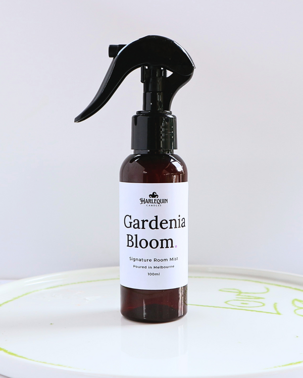 Harlequin Candles Gardenia Bloom 100ml signature room mist in a premium amber spray bottle on a minimalist white ceramic tray, hand-poured in Melbourne Australia.