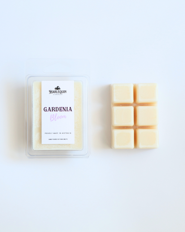 Harlequin Candles gardenia soy wax melts clamshell package next to unwrapped 6-cube bar hand poured in Australia