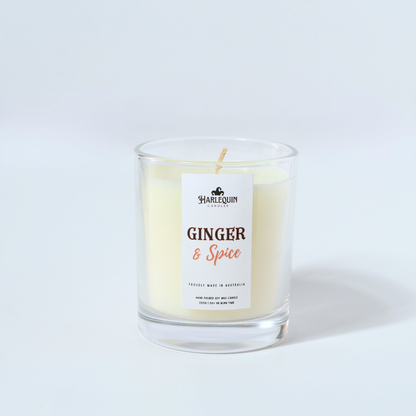 A Harlequin Candles "Ginger ans Spice" hand-poured soy wax candle in a clear glass jar.  Premium Australian made scented candle.