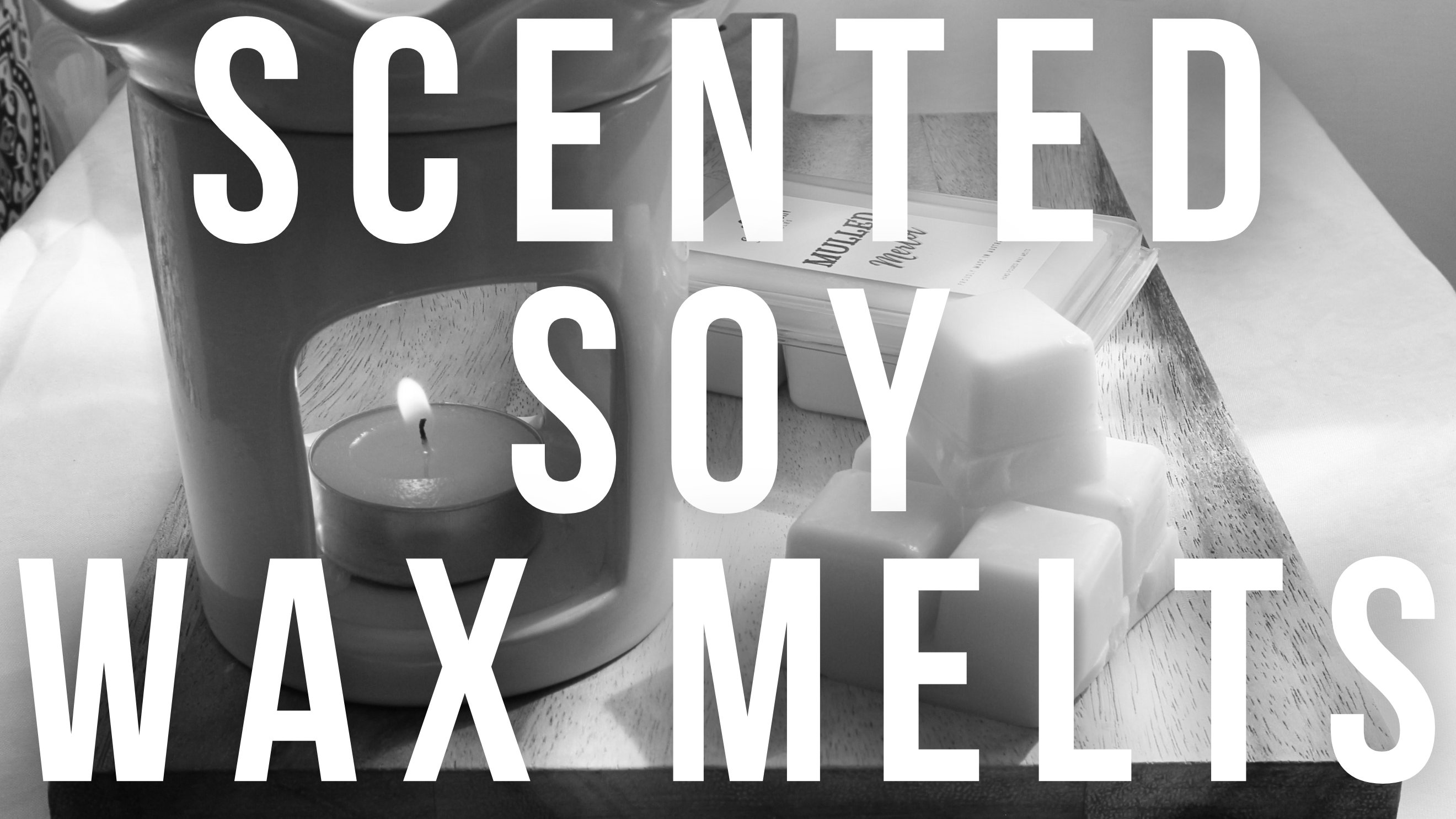Monochrome banner with 'SCENTED SOY WAX MELTS' text prominently displayed. Features a ceramic wax warmer with a lit tealight candle, a stack of soy wax melt cubes, and a wax melt clamshell, highlighting Harlequin Candles' home fragrance range.