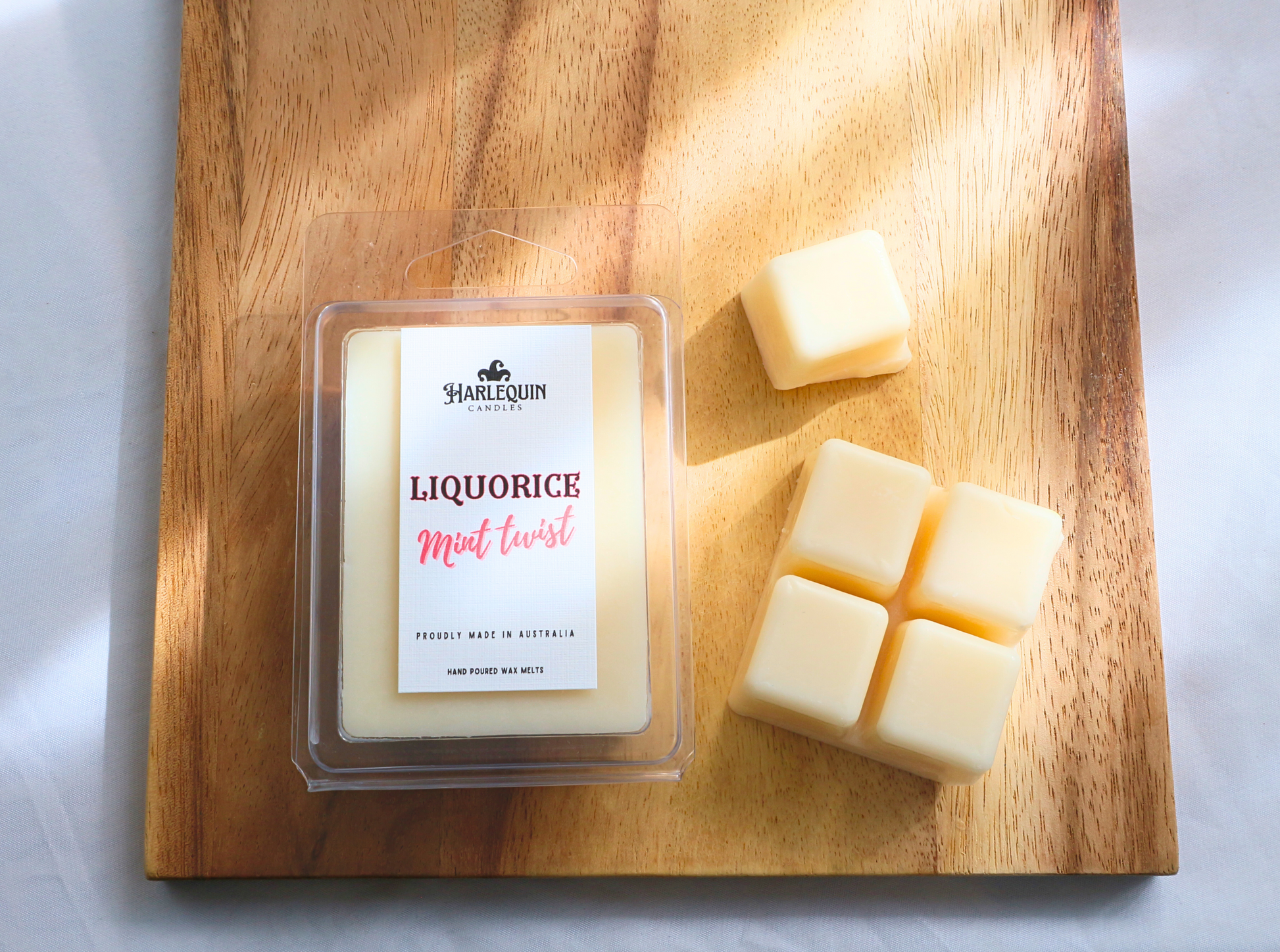 "Licorice Mint Twist" Individually portioned soy wax melt cubes in a clamshell package.