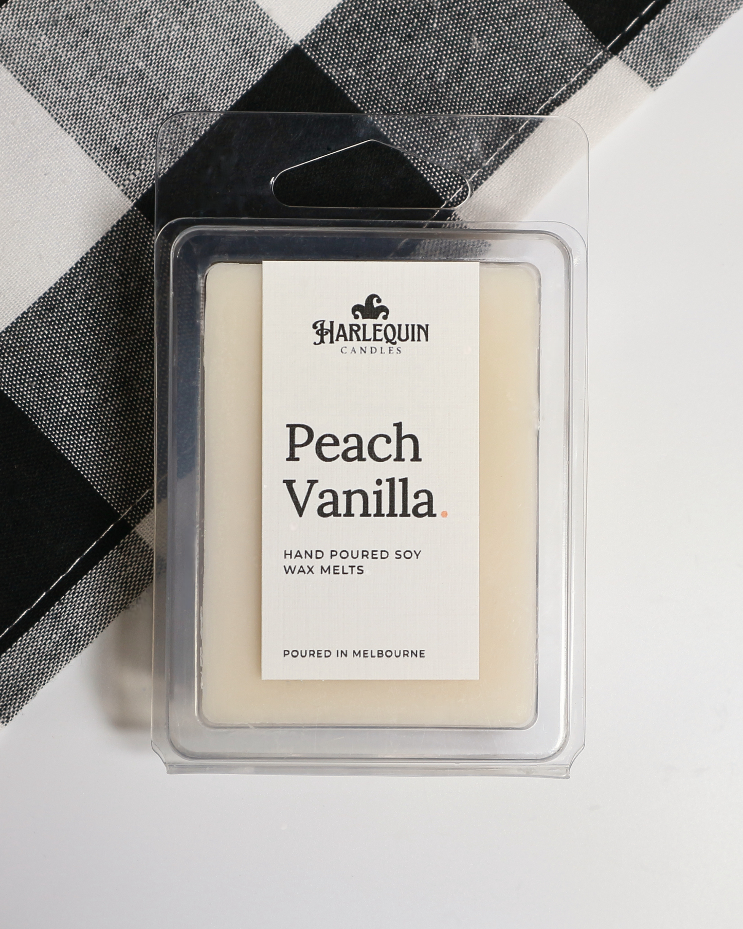 Peach Vanilla soy wax melts by Harlequin Candles, hand-poured in Melbourne with ripe peach, creamy vanilla and coconut in a clear clamshell.