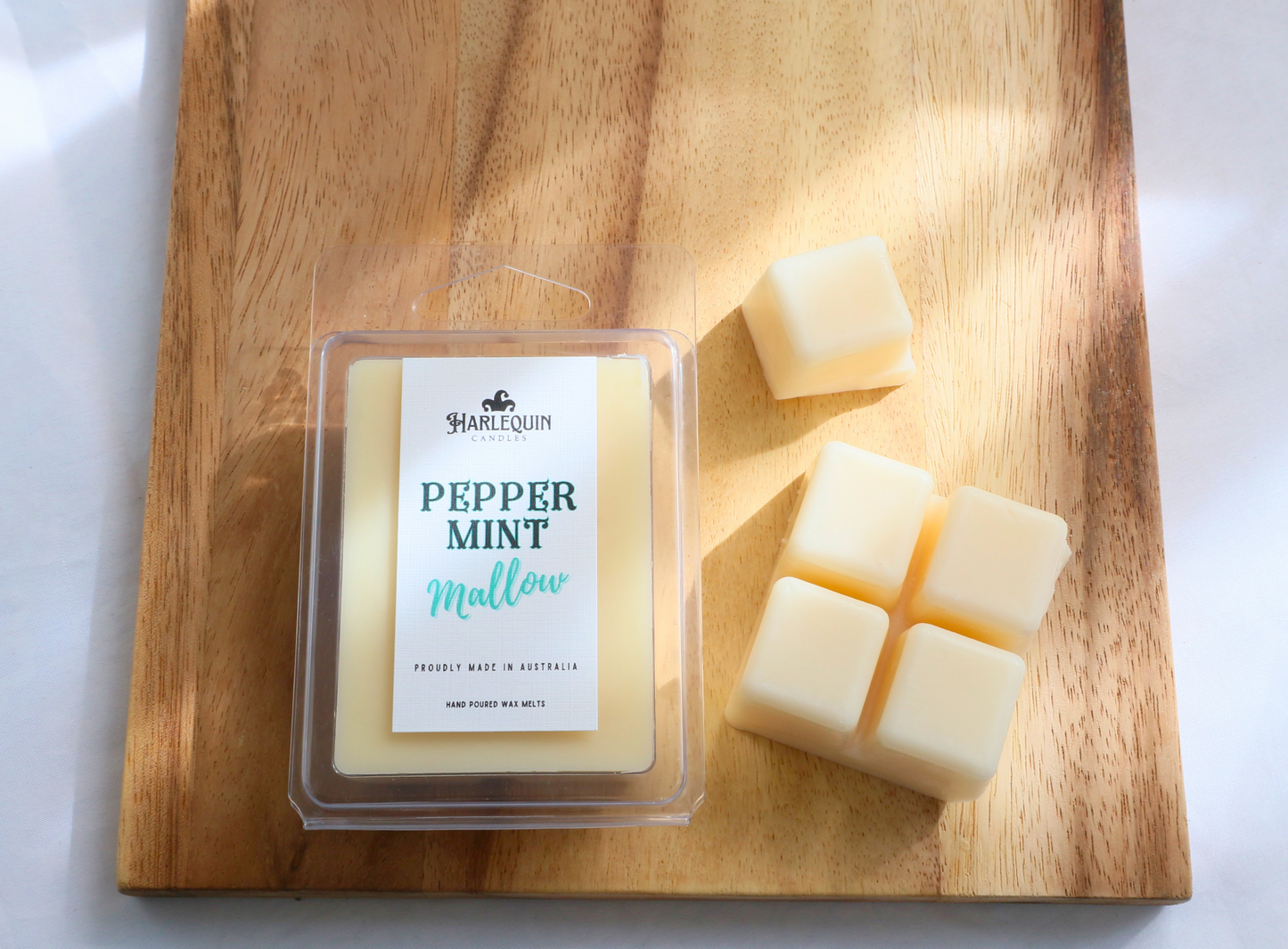 "Peppermint Mallow" soy wax melts from Harlequin Candles, presented in a clamshell package with break-apart cubes.