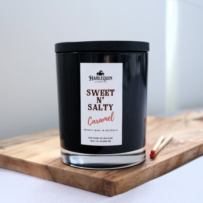 Harlequin Candles "Sweet n' Salty Caramel" candle in black jar with lid, made in Canberra, Australia.