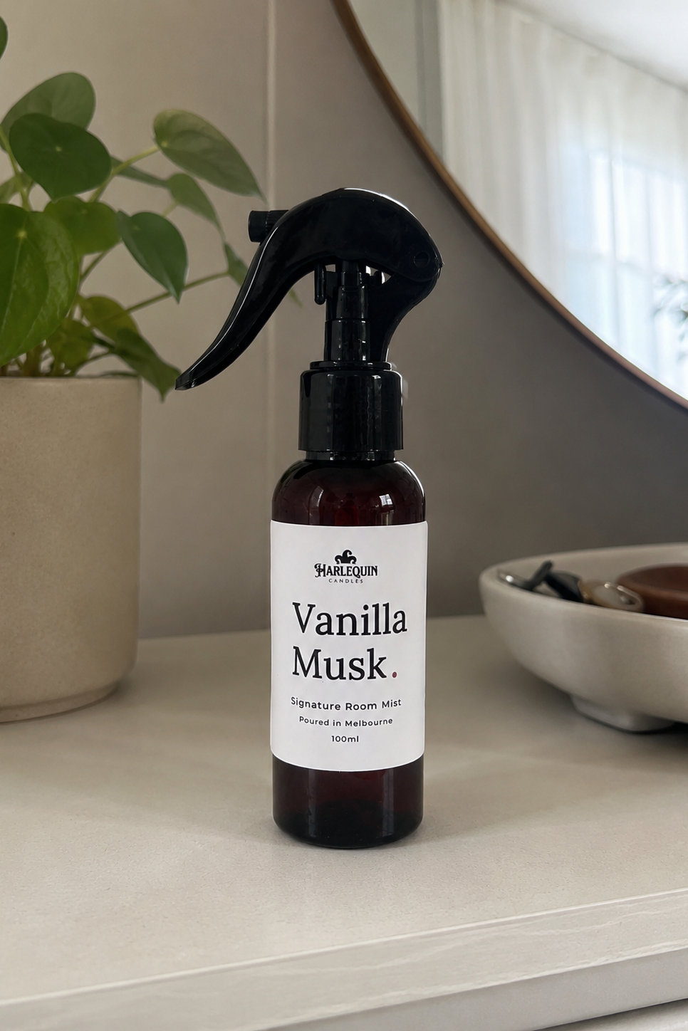 Harlequin Candles Vanilla Musk Signature Room Mist, handmade home fragrance spray styled in a modern living room.