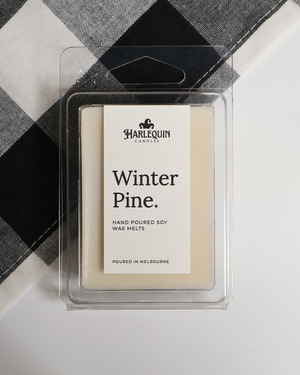 Winter Pine soy wax melts by Harlequin Candles, hand-poured in Melbourne with bergamot, pine, cedarwood and patchouli in a clear clamshell.